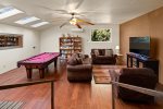 The family room features a billiards table and flat screen TV